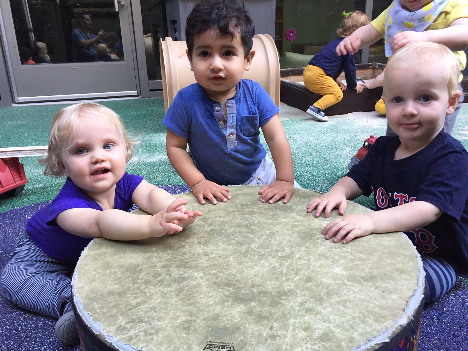 Older infants drumming